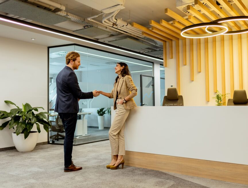 warm-handshake-between-colleagues-in-modern-office-2025-02-21-17-57-38-utc (1)